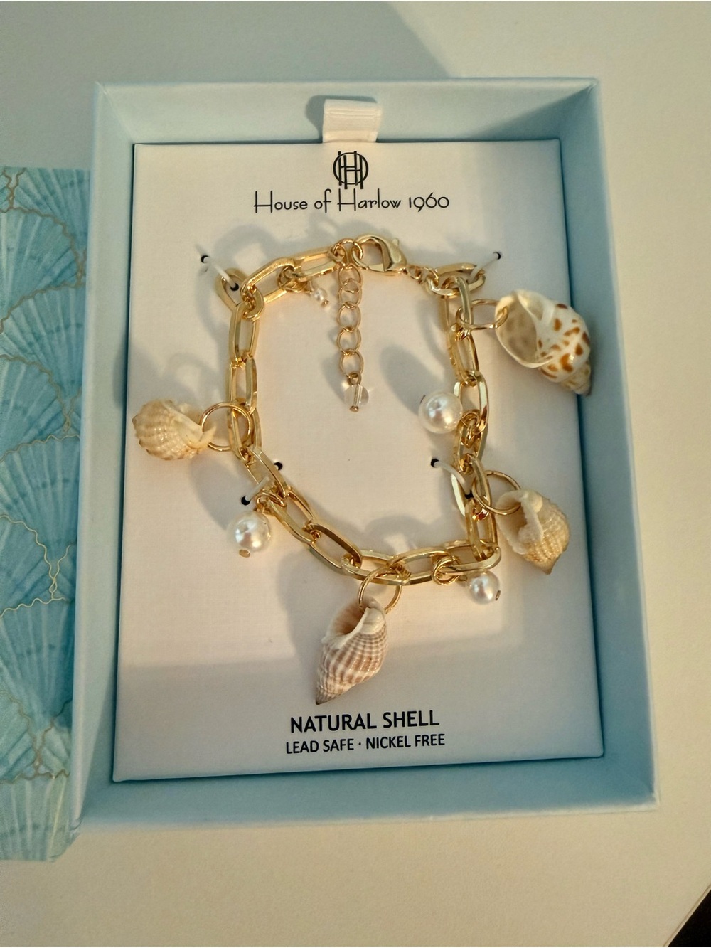 New in gift box! Gorgeous paper clip bracelet with sea shell charms.